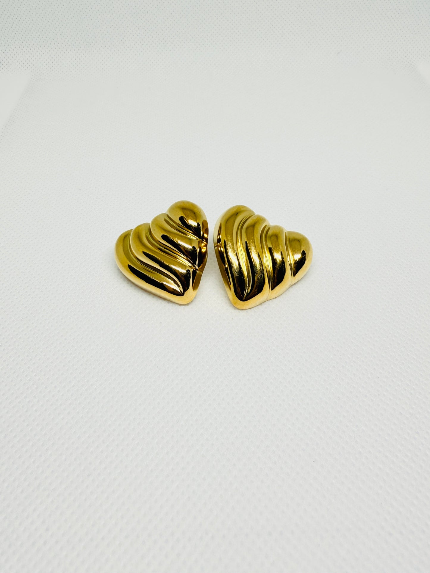 Wavy heart shaped studs