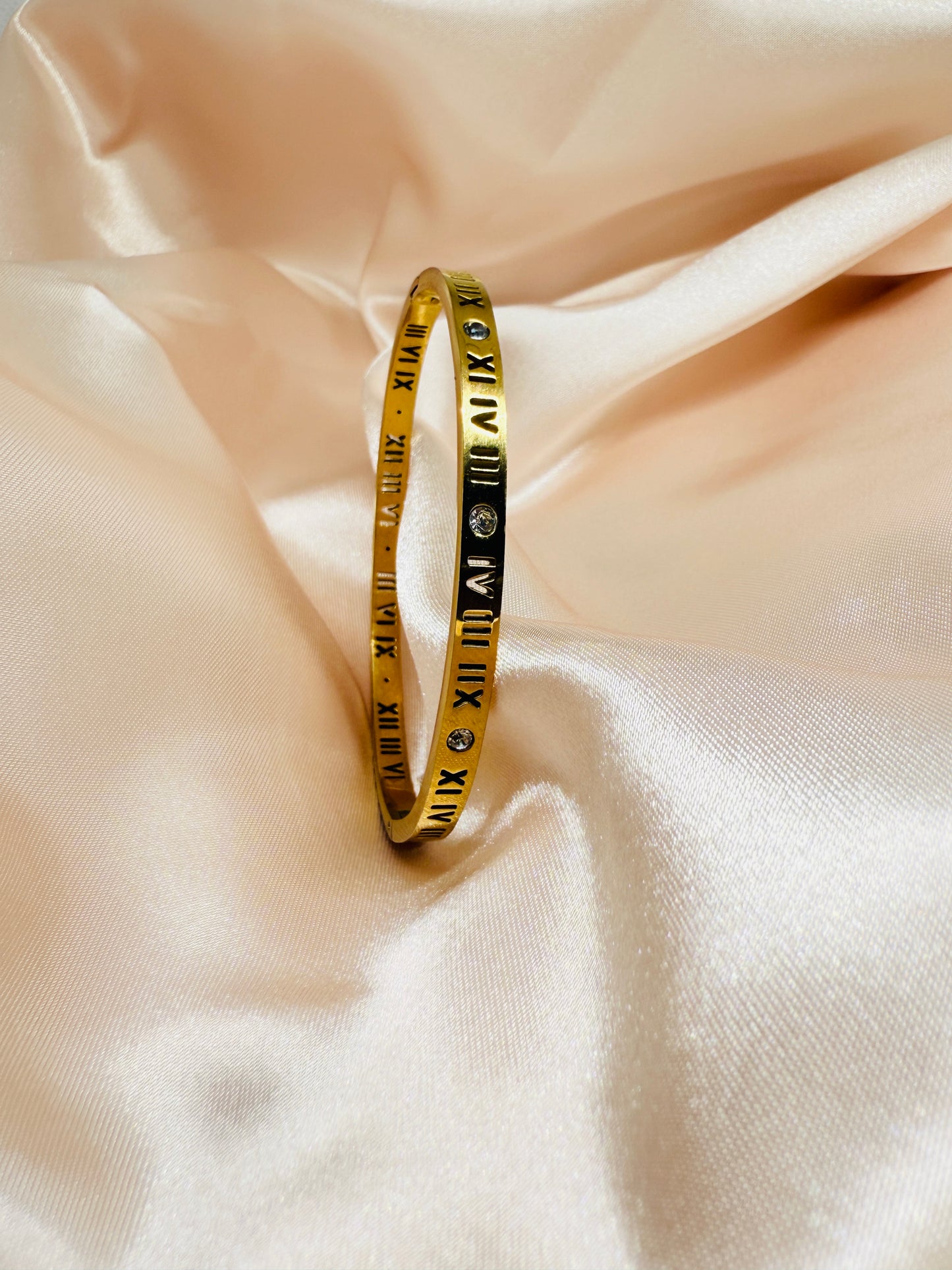 Roman numerals and diamond-studded bangle