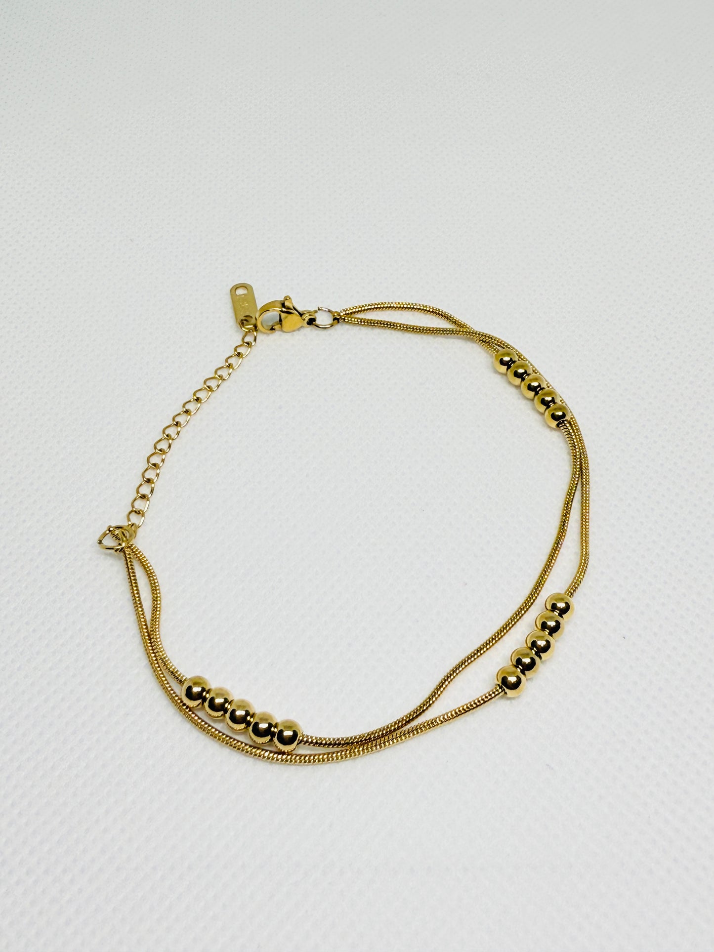 Layered golden beaded bracelet