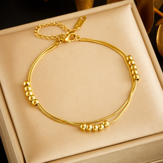 Layered golden beaded bracelet